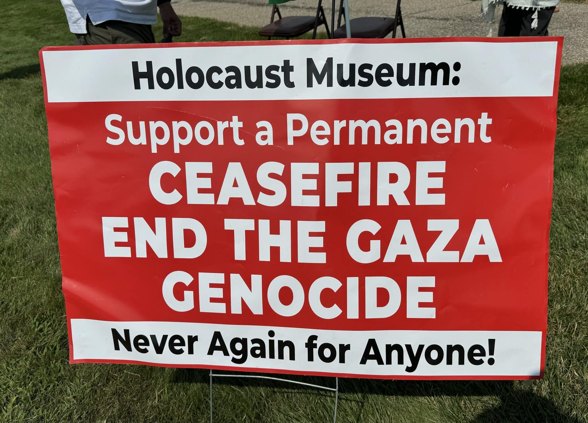 Detroit resistance demands a permanent ceasefire be levied against the local holocaust center according to this sign.