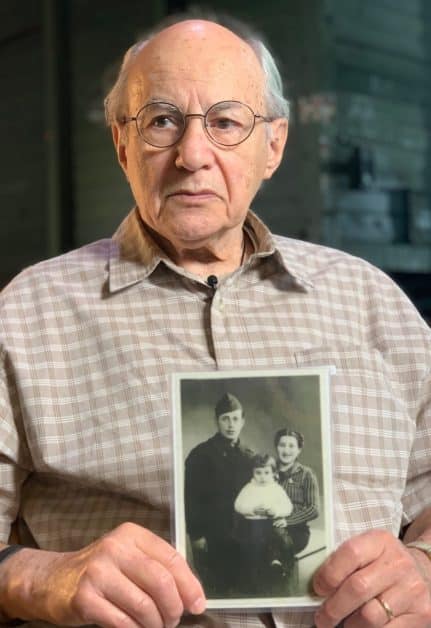 René Lichtman 12/04/1937 - 01/28/2025 - pictured holding a picture of his early family in France.